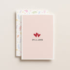 Front of anniversary love date greeting card with pastel envelope behind