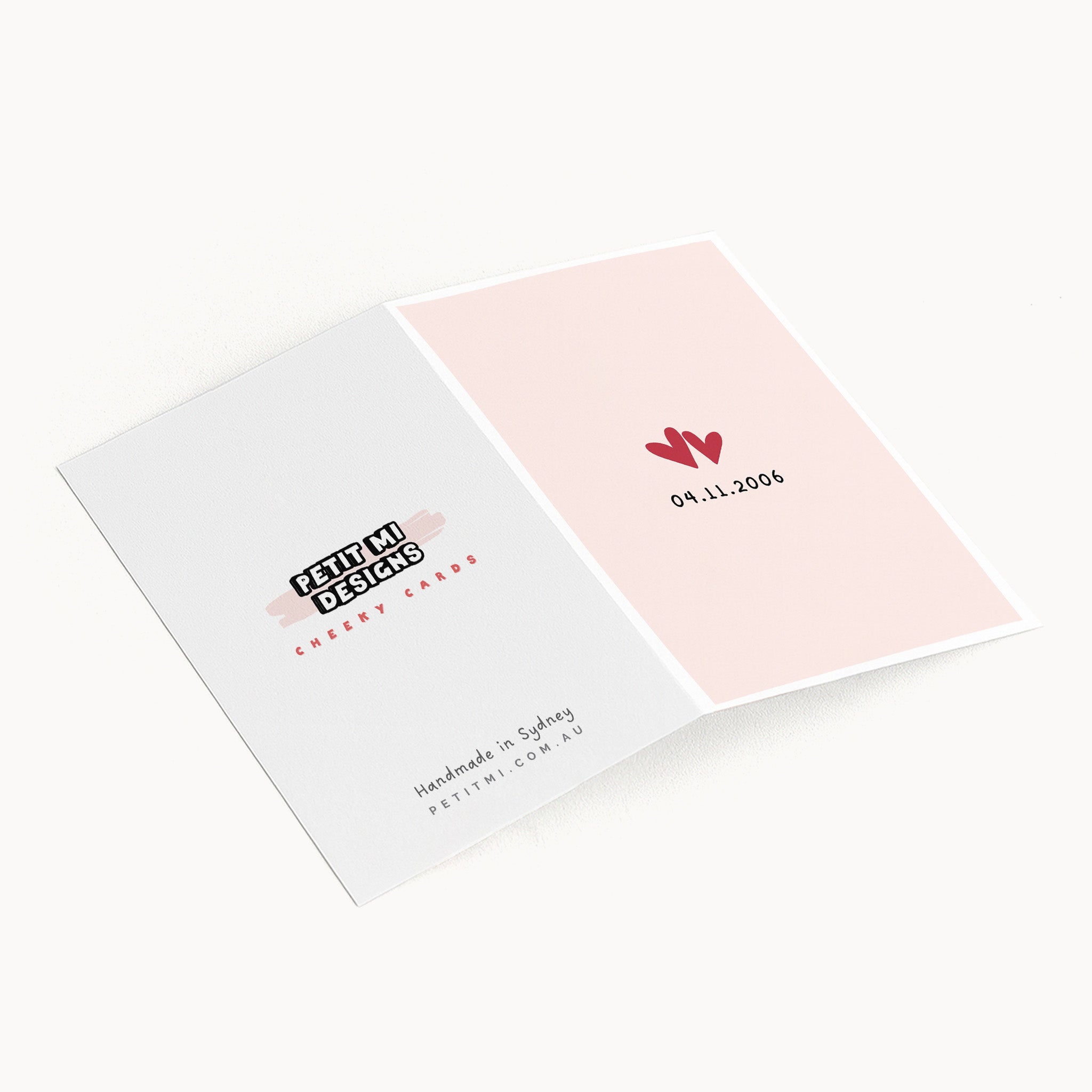 Inside view of anniversary love date greeting card showing heart design and Petit Mi branding